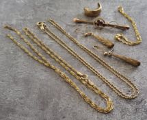 Two 9ct gold fine necklaces (one af); a 9ct gold fine bracelet; a 9ct gold bar brooch set with three