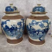 Oriental Ceramics - a substantial pair of Chinese crackle glazed blue and white baluster shaped