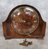 A 1950's Smiths mahogany mantel clock, gilt Roman numerals and hands, twin winding holes complete