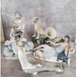 Lladro including figure of a young girl riding a bicycle; a Flapper girl reclining on a day bed (
