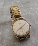 A 9ct gold Trebex gentleman's wristwatch, 17 jewel movement, white dial, gold coloured Arabic