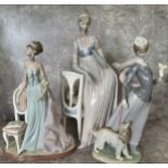 A Lladro figure of an Elegant Lady standing beside a boudoir chair no 1495 37cms h, (faults);