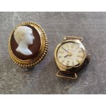 A 9ct gold lady's Regency watch case approx. 1.89g; a small yellow metal mounted oval cameo brooch