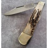 Stan Shaw; A Single Blade Pocket Knife, with stag scales and n/s bolsters to both ends, brass worked