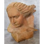 Garden Statutory- a 20th century terracotta sculpture of a woman with wind flowing through her hair,