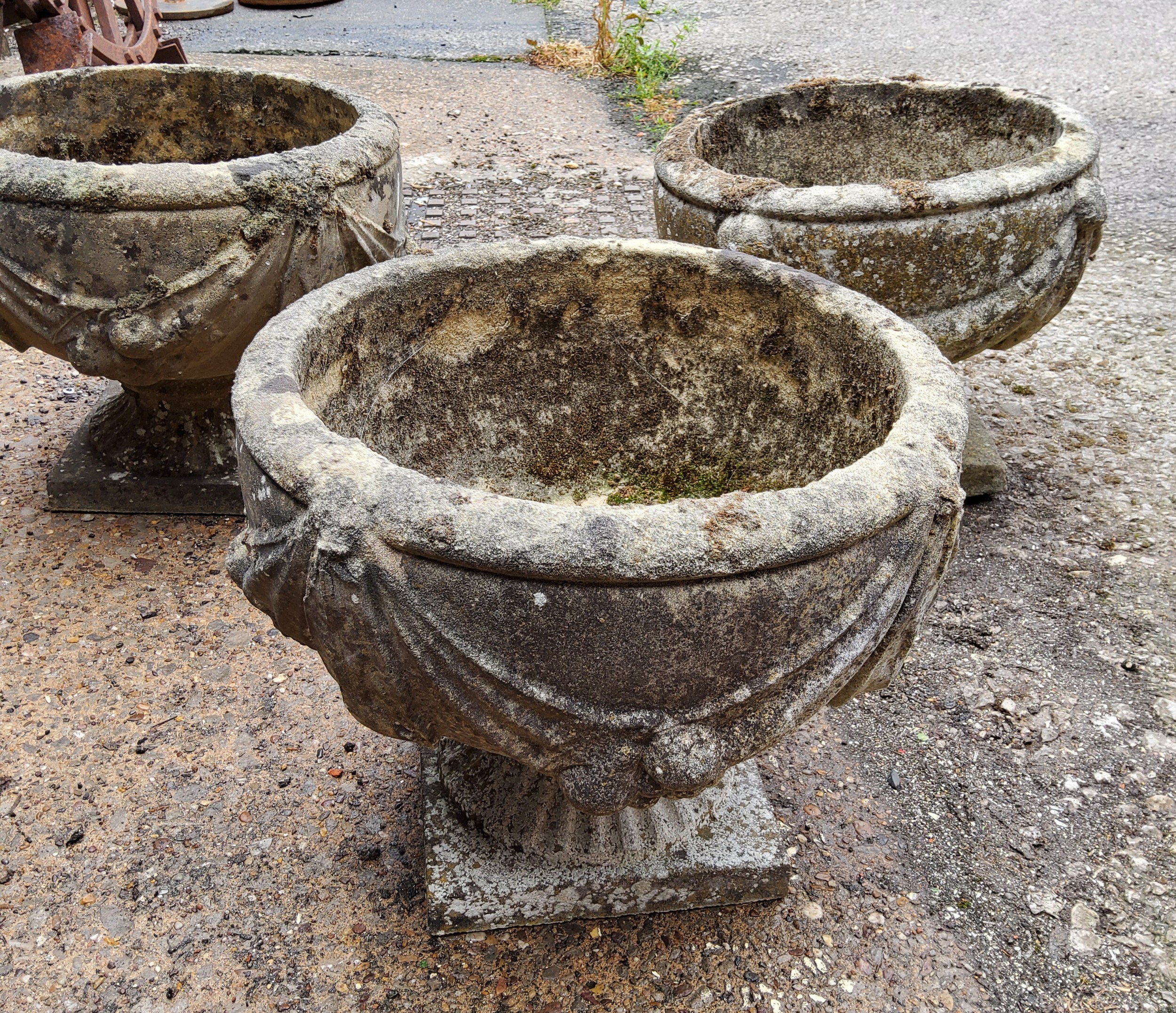A set of three squat cast concrete planter / urn,  depicting bows and fruits 34cm h x 37.5 cm dia - Image 3 of 4