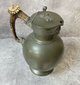 A late Victorian James Dixon & Son pewter claret jug with hinged cover, Bacchus mask to spout,