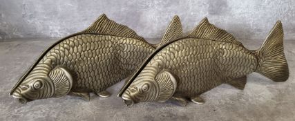 A pair of pewter serviette/menu holders in the form of carps