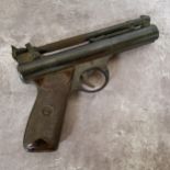 A .22” Webley Premier Series “E” air pistol, number 213 and numbers “2 1” beneath left grip, with