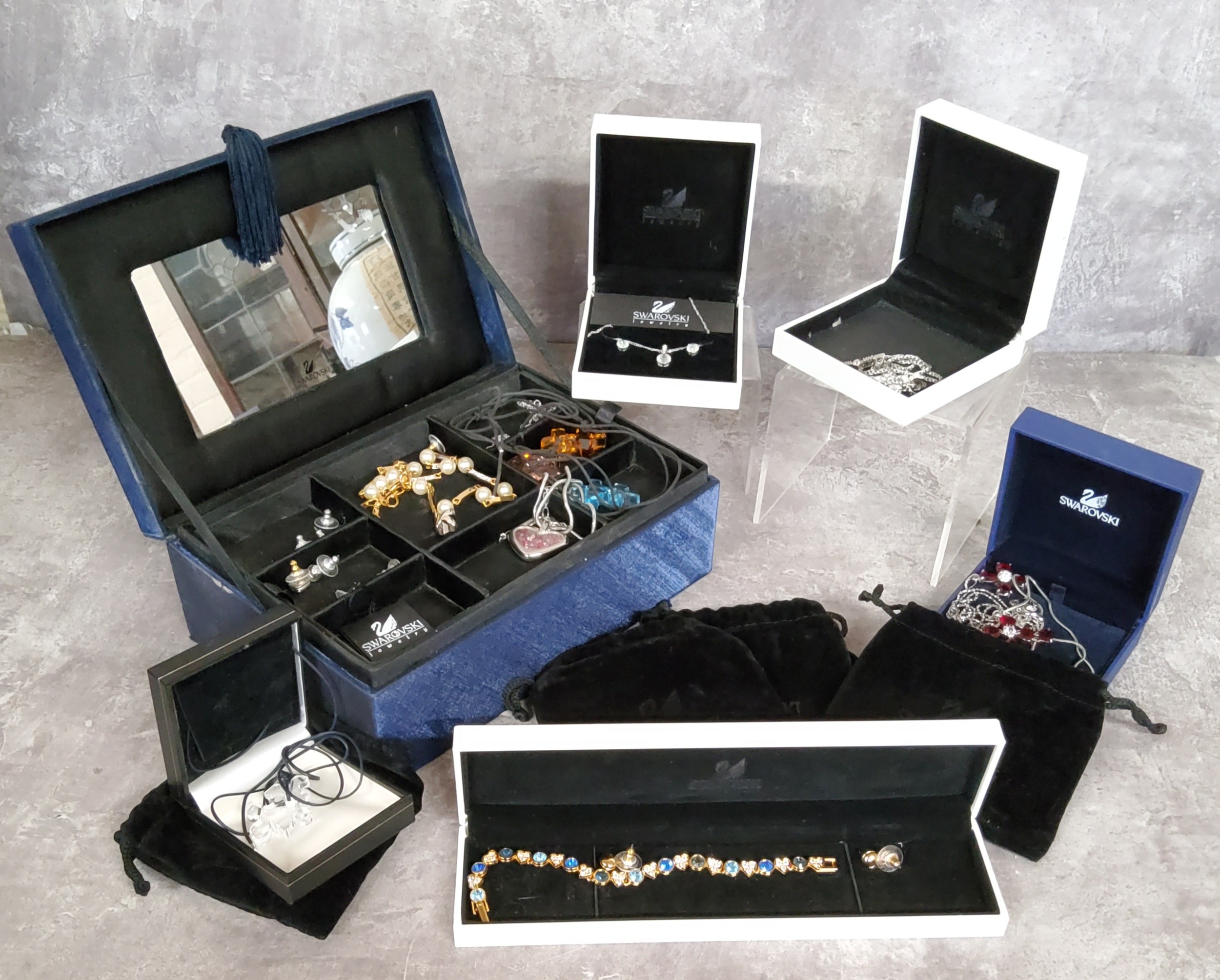 Swarovski Jewelery (sic) including a clear, an amber & a blue crystal jigsaw piece necklaces;