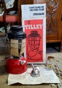 A Tilley storm light X246B, in original packaging, unused with accessories and instructions