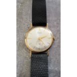 An Avia 9ct gold gentleman's wristwatch, Swiss 17 jewels movement; silver dial, gold batons & hands,