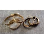 Four 9ct gold wedding bands 5.35g; a pair of 9ct gold hoop earrings 1.9g