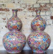 A pair of impressive Chinese double gourd vases, with colourful millefleur Canton enamel decoration,