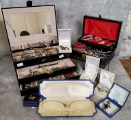 Two jewellery boxes containing costume jewellery including necklaces, earrings, bracelets etc.; a