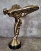 A large silver plated solid cast metal sculpture of The Spirit of Ecstasy, raised a round marble