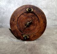 A substantial Victorian Scarborough reel with brass mounts c.1880, 21cm diameter