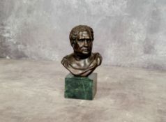 After the antique, a bronze library bust of a Roman emperor raised on a Verdigris marble plinth base