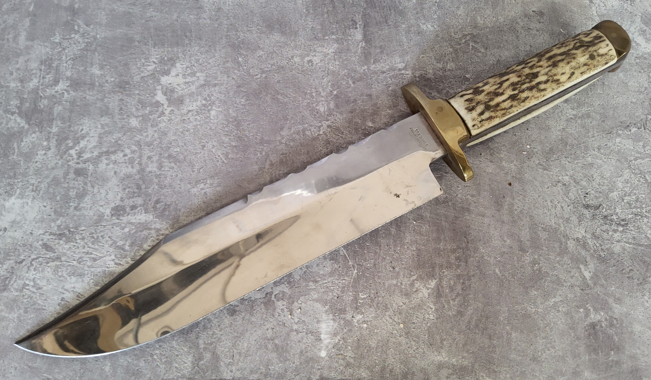 A Bexfield of Sheffield Bowie knife, horn scales, brass cross guard, jimping to blade, 25.5cm blade,