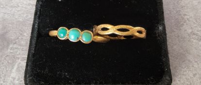 A 22ct gold open Celtic plait band 2.88g; a 22ct gold set with three round turquoise stones 4.43g