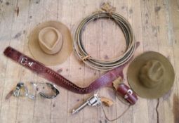Americanna - a cowboy reenactment Colt pistol with holster; lasso, spurs and Stetson type hats
