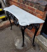 Black cast iron table with white marble top