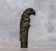 A Verdigris bronze parasol handle in the form of a parrot
