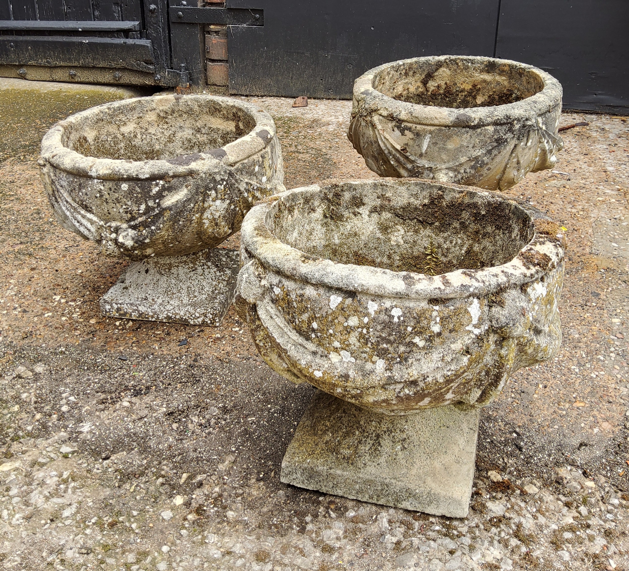 A set of three squat cast concrete planter / urn,  depicting bows and fruits 34cm h x 37.5 cm dia - Image 4 of 4