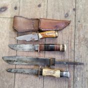 A Knife by Wade & Butcher, Sheffield marked XCD, banded handle with antler finish; a Sheffield
