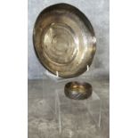 An early 20th century Indian white metal bowl chased throughout with borders (tests as silver); a