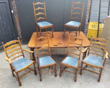 Victorian oak wind out dining table with six chairs, including winding handle, four dining and a