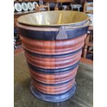 A Dutch walnut and ebonised kettle bucket, decorated with turned banded construction, with a brass