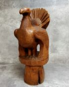 An unusual carved wood sculpture of a turkey, signed M.Meriel, marked 'Tetras' to base, standing