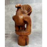 An unusual carved wood sculpture of a turkey, signed M.Meriel, marked 'Tetras' to base, standing