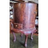 A 19th century type burr walnut fuel bin holding one small drawer to cylindrical body raised on four