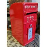 A reproduction 'ER' cast iron post box, in red livery with gilt detail, with two brass keys, 56cm