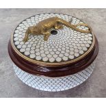 A Continental porcelain circular box and cover, the cover mounted with a bronzed metal lizard,