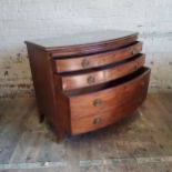 A George III chest of drawers holding three long cock beaded drawers c.1800