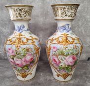 A pair of French large baluster shaped ceramic vases the main central panel hand painted with pink