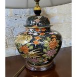 An 'Oriental' lamp base in the form of a ginger jar, decorated in 'Cloisonné' style with peonies &