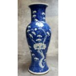 A 19th century Chinese underglaze blue and white baluster vase decorated with flowering prunus,