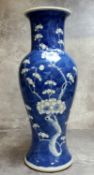 A 19th century Chinese underglaze blue and white baluster vase decorated with flowering prunus,