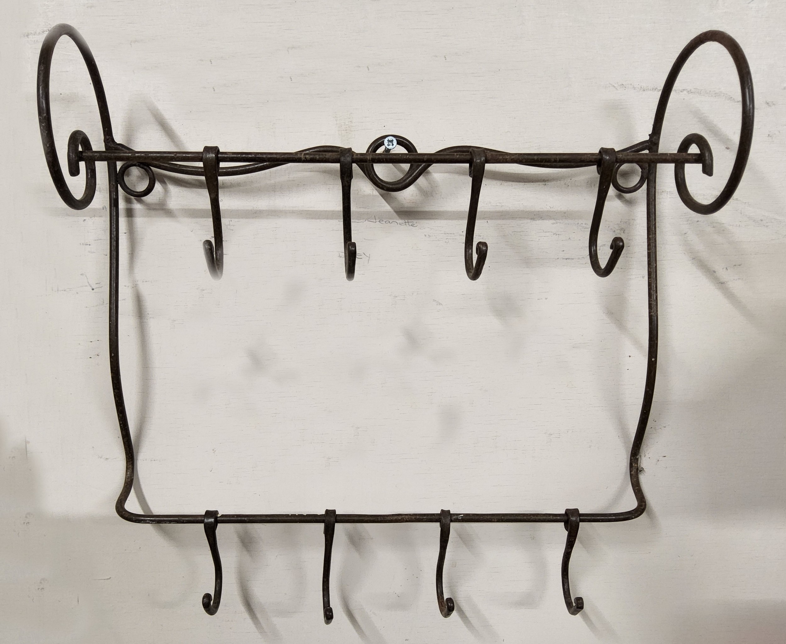 An unusual wrought iron farmhouse kitchen game hanger