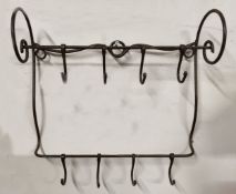 An unusual wrought iron farmhouse kitchen game hanger