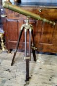 A 20th century brass freestanding telescope on a tripod base 100cm high