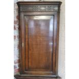 An early 19th century oak corner cupboard, with key 104cm high x 58cm w x 25cm d