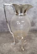 A silver plated mounted glass claret jug after a Design By Christopher Dresser, hinged cover the