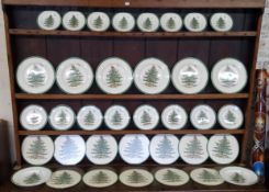 A comprehensive Spode Christmas Tree pattern table setting for eight