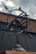 A painted metal armillary sphere
