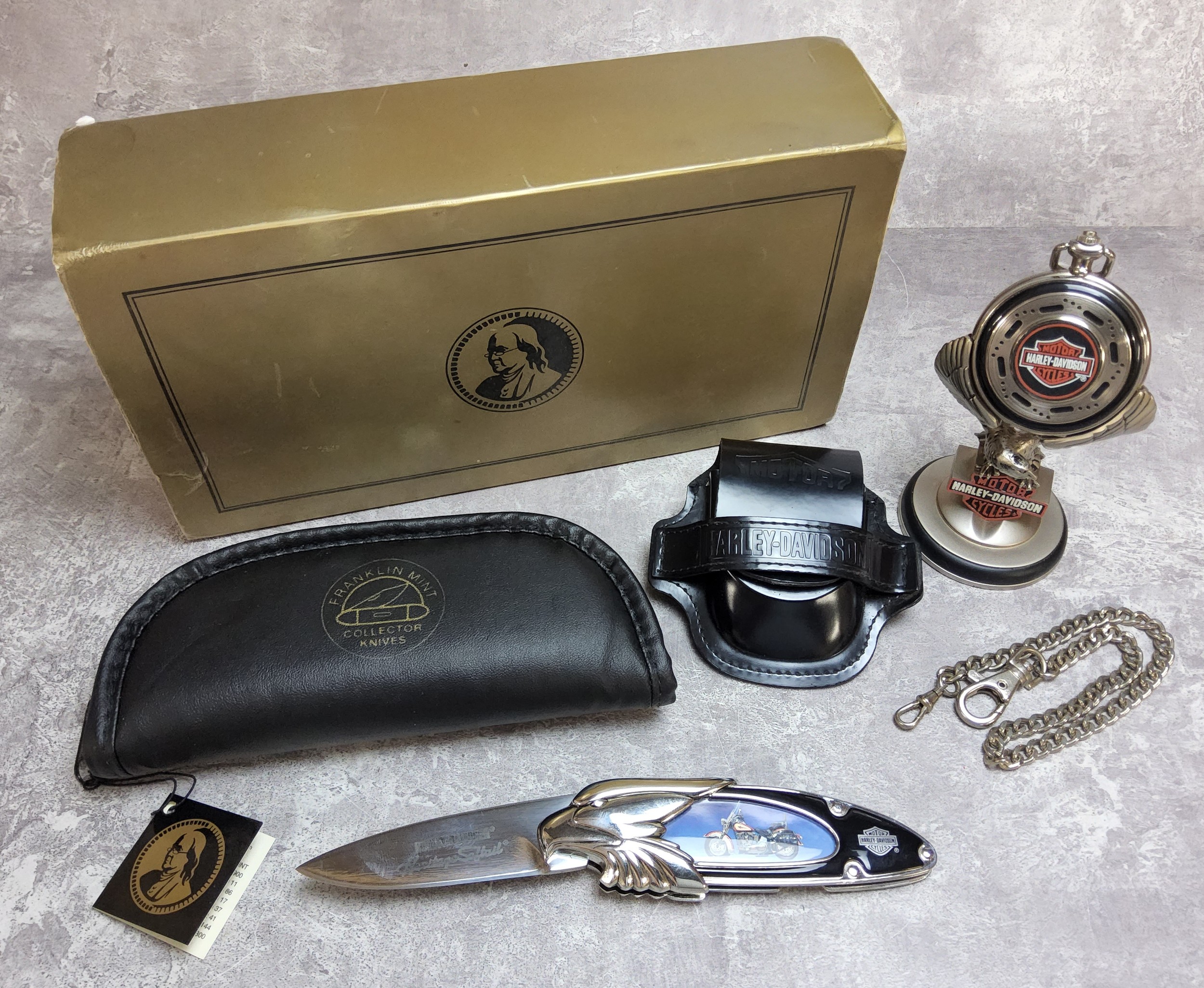 A Franklin Mint Collectors Knives Harley Davidson penknife with pouch and packaging; a Franklin Mint